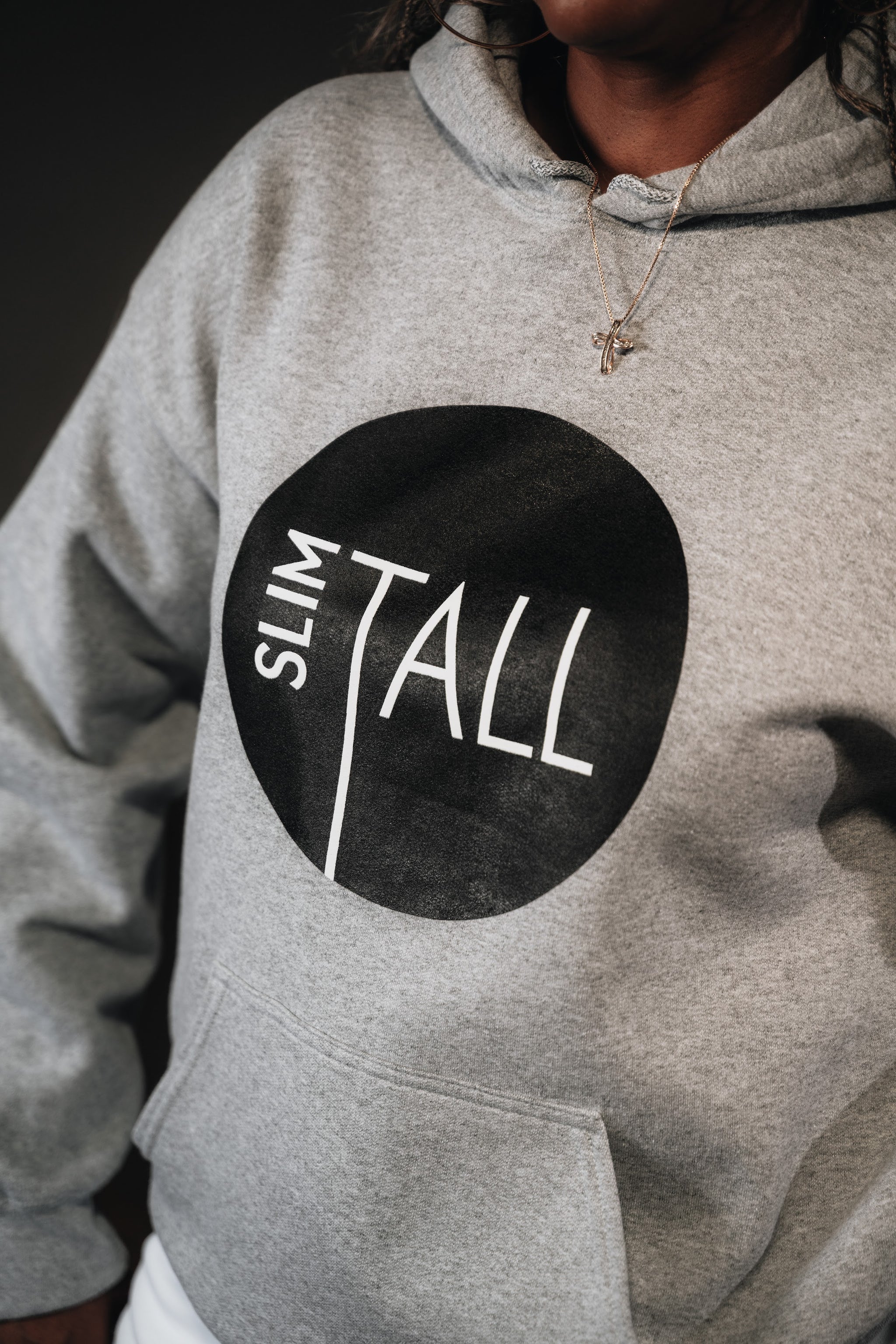 SlimTall Signature Hoodie in grey with the black circle logo and white SlimTall lettering, close-up