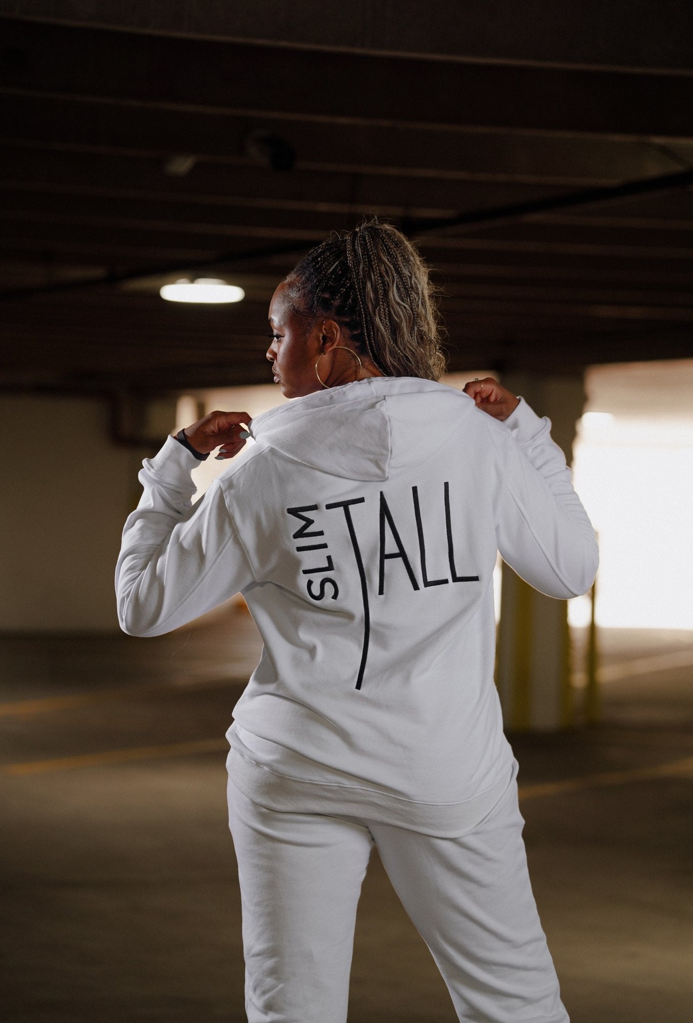 SlimTall white tracksuit set, back with embroidered logo. Model is 5'11" wearing size L